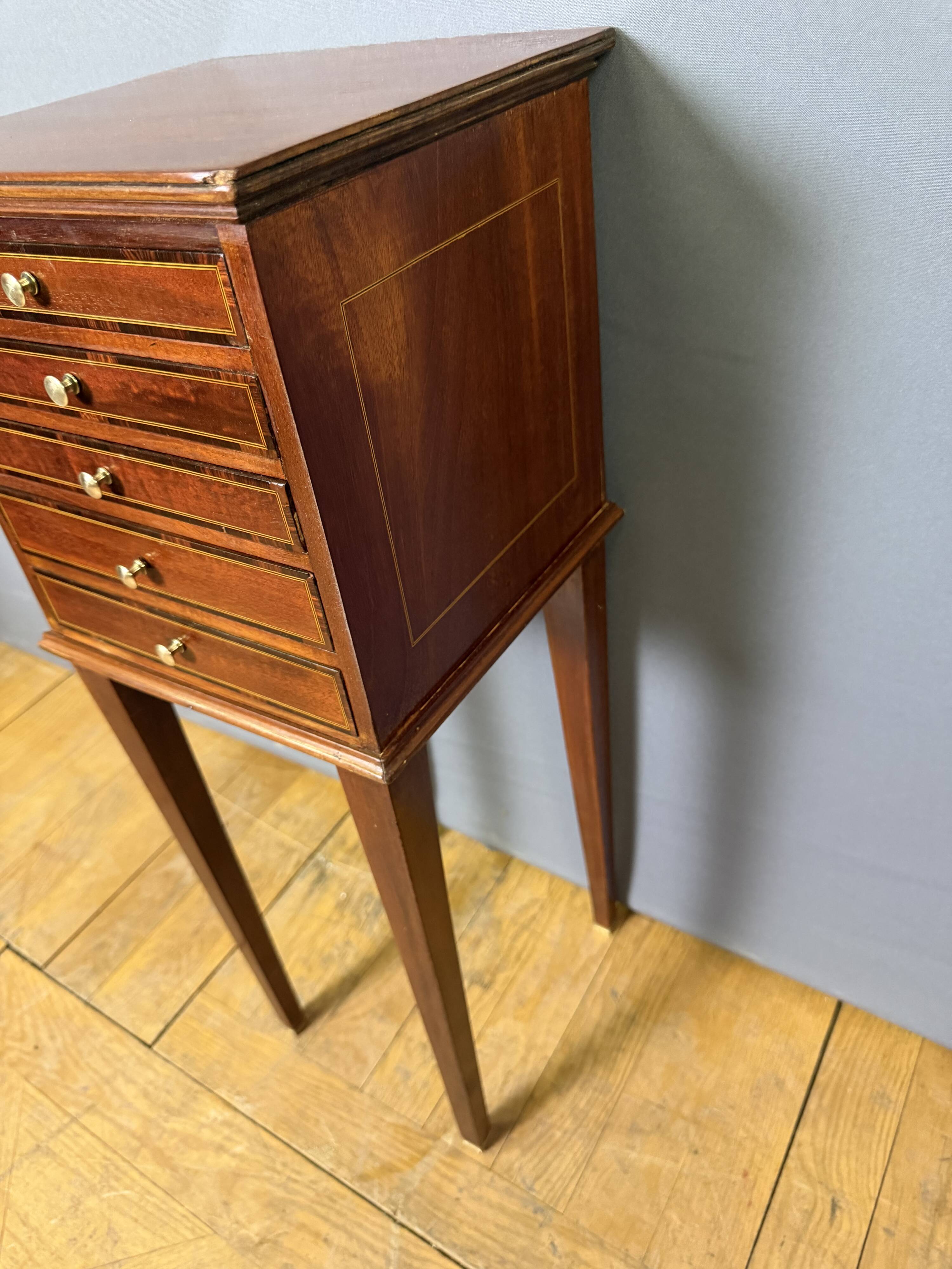 Louis XVI bedside table in mahogany with five drawers.