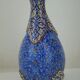 Piriform vase with a flared metal collar enamelled with a polychrome decoration, marked "Amini Iran" on the reverse.