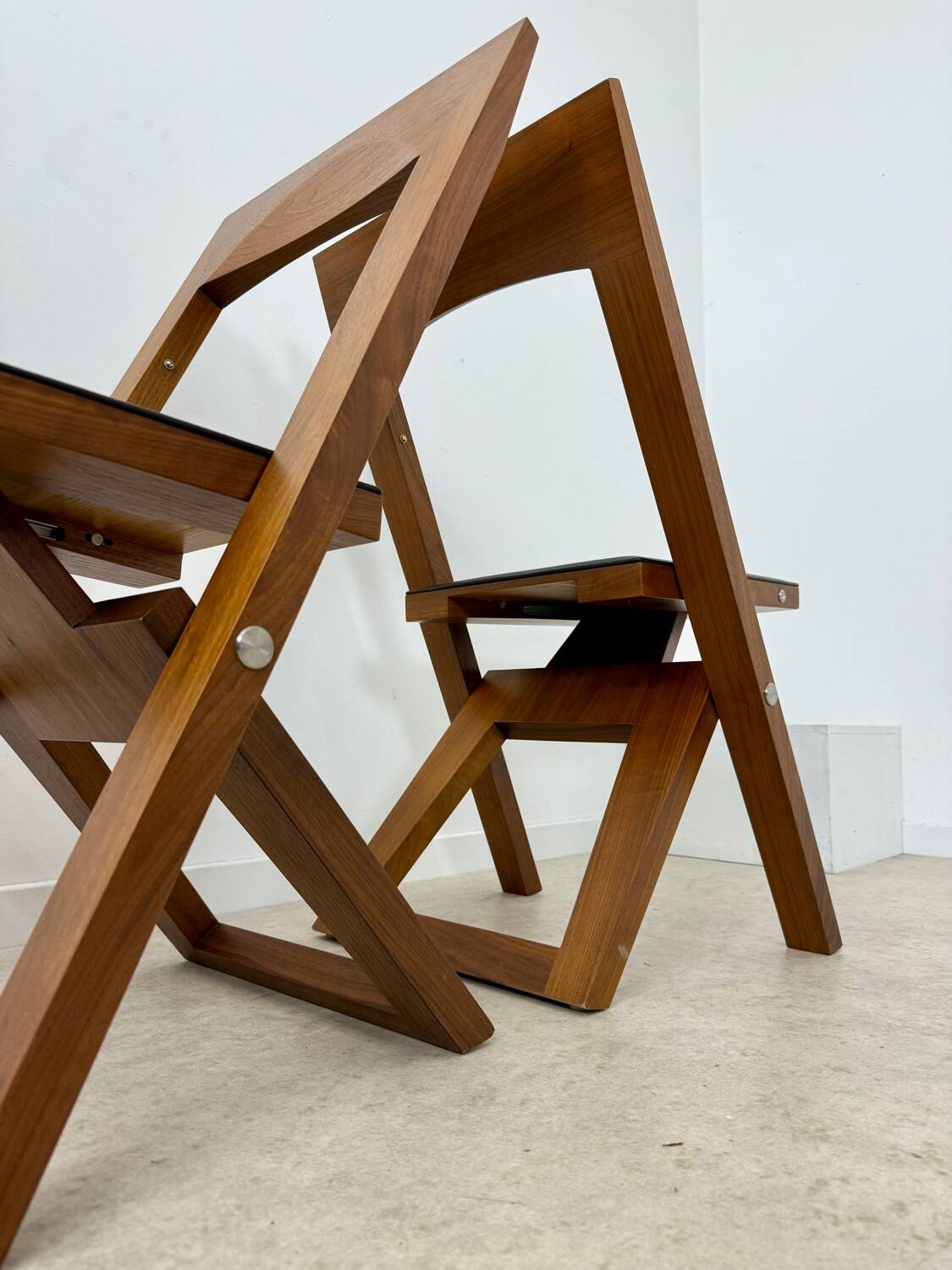 2 old folding chairs in wood and leather, postmodern design from the 80s vintage