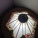 Tiffany-style stained glass lampshade with floral motifs.