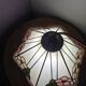 Tiffany-style stained glass lampshade with floral motifs.