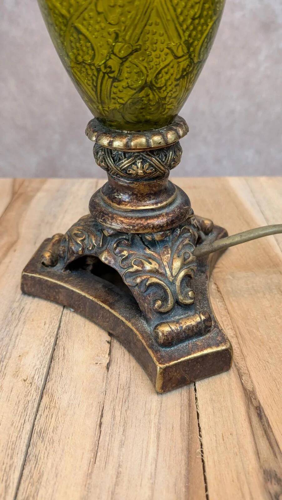 Vintage lamp with bronze imitation base & green relief glass in an antique style.