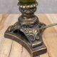 Vintage lamp with bronze imitation base & green relief glass in an antique style.
