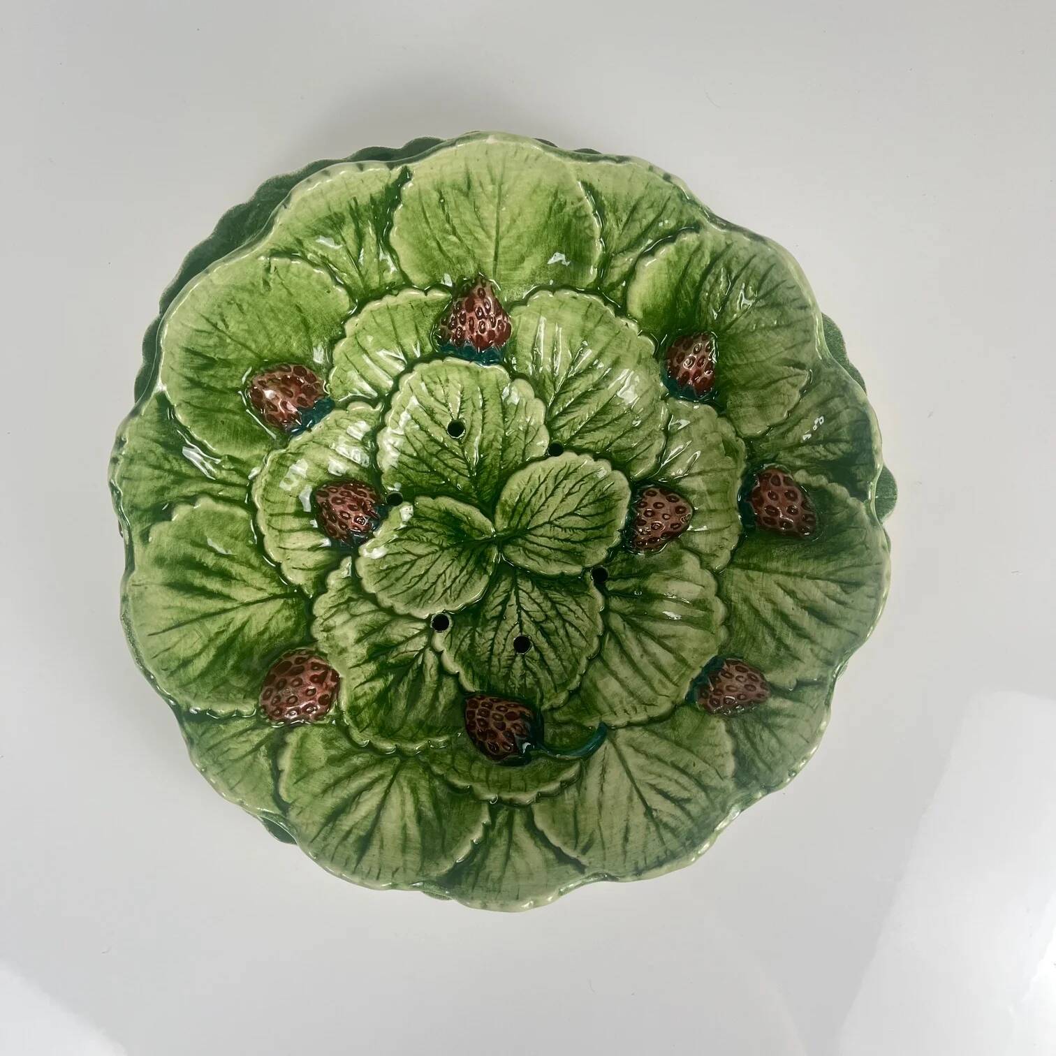 Leaf and strawberry-shaped bowl/strainer.