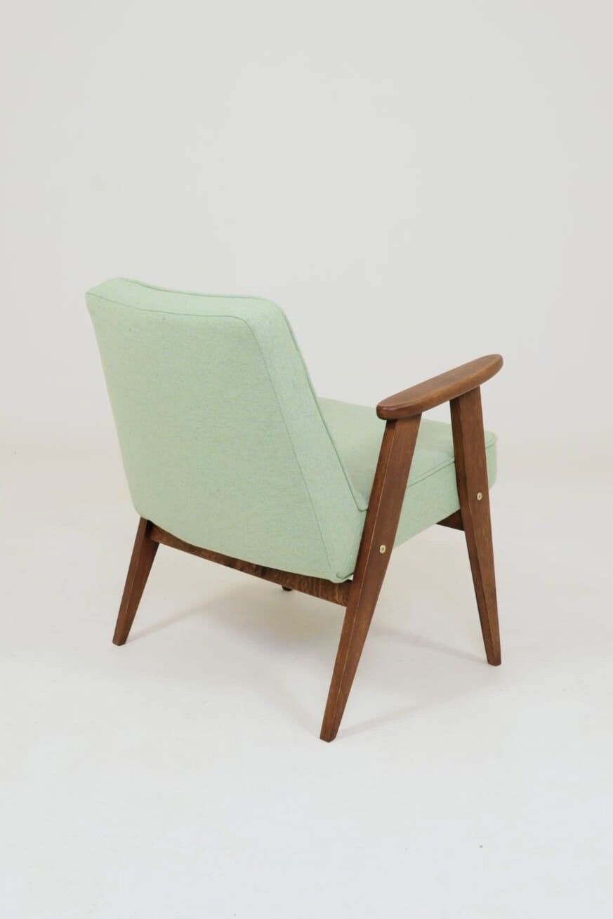 Pastel pistachio wool fabric Scandinavian armchair, oak wood.