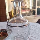 Blown glass decanter, engraved and chiselled. Made in France.