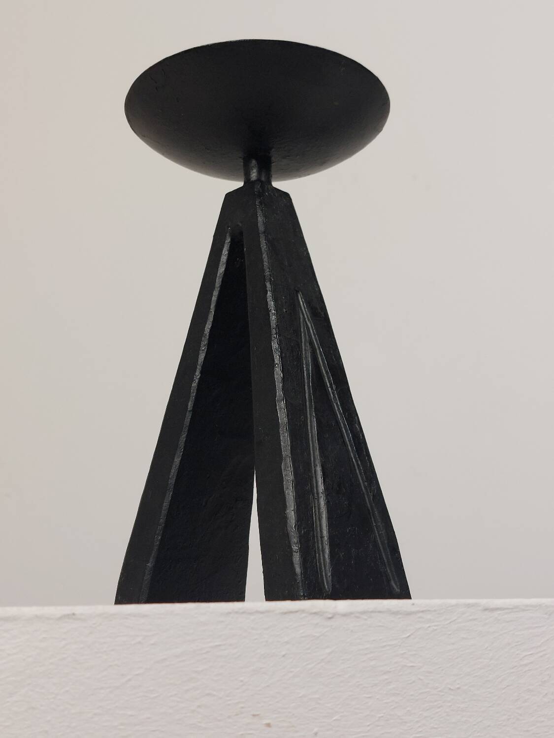 Vintage candle holder made of hand-forged metal, in a brutalist style.