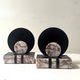 Art Deco bookends with a circular design in black and pink marble.