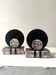 Art Deco bookends with a circular design in black and pink marble.