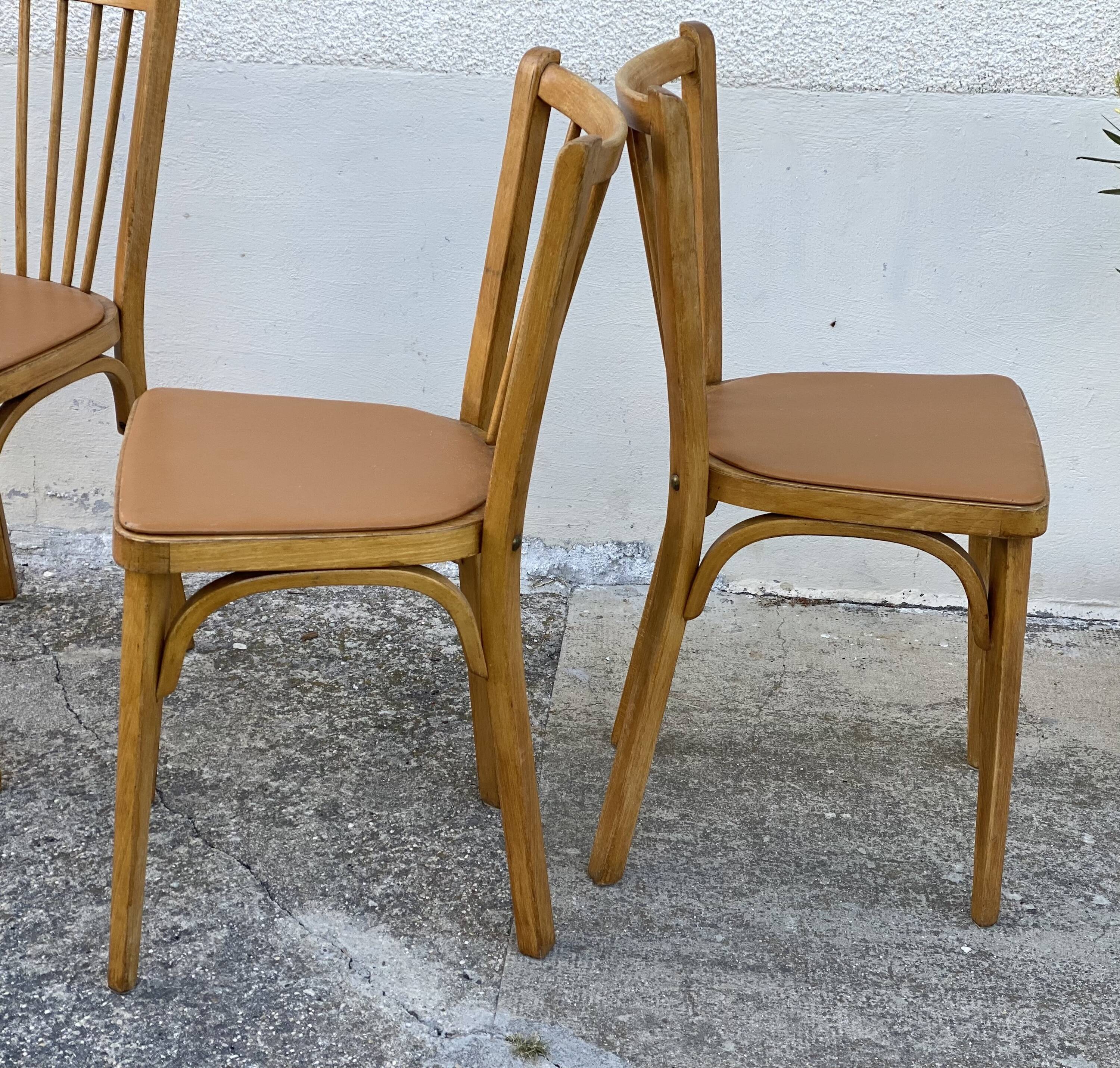 Série de 4 chaises bistros vintage 1950-60 assises Skaï