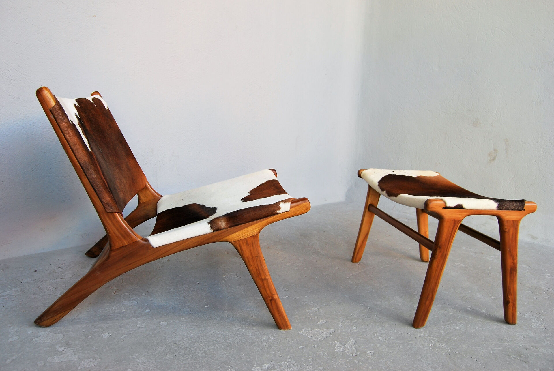 Chair in cowhide with ottoman inspiration Norwegian
