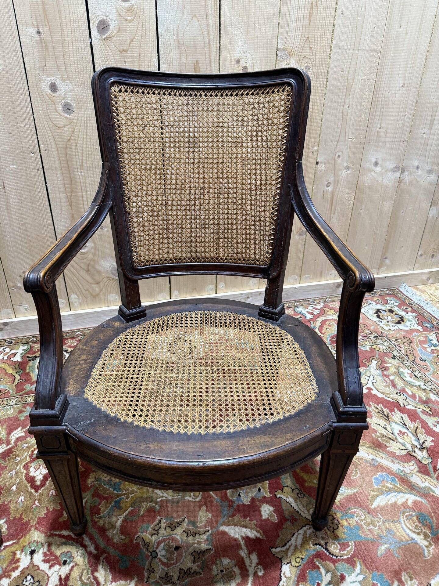 Pair of Louis XVI period caned armchairs
