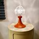 Space age lamp in orange glass and metal, around 1960.