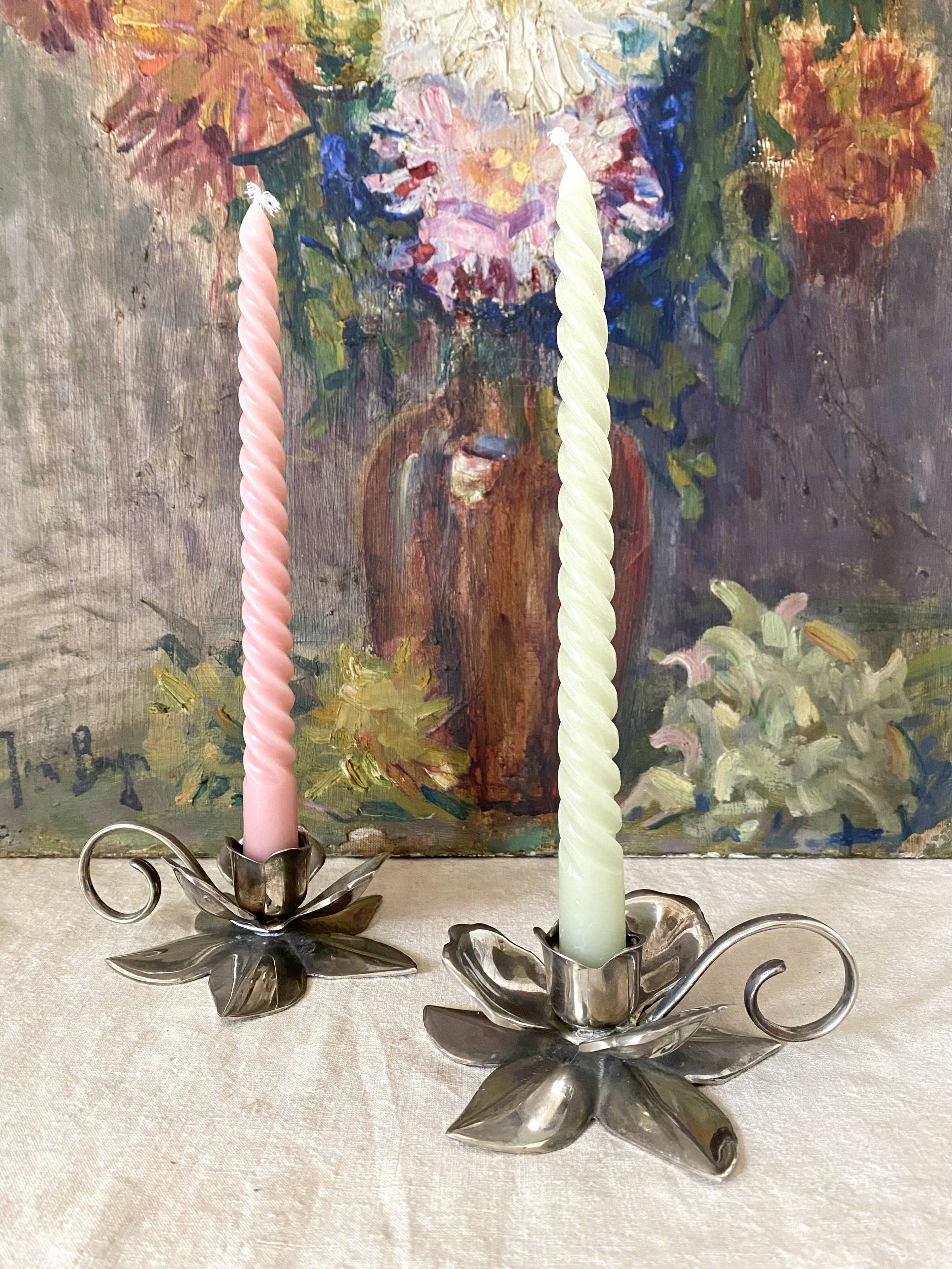 Pair of silver metal flower candle holders