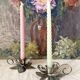 Pair of silver metal flower candle holders