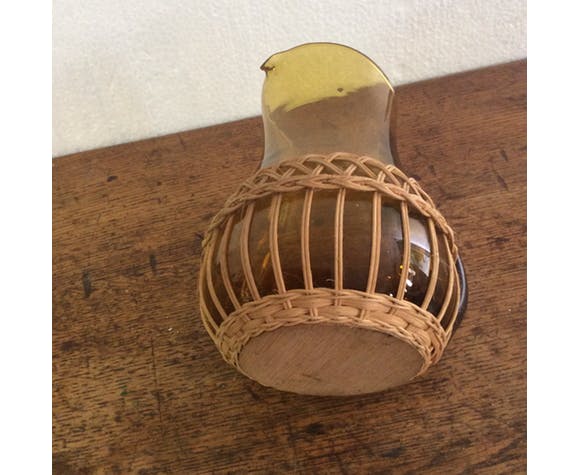 Pitcher dressed in wicker