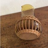 Pitcher dressed in wicker