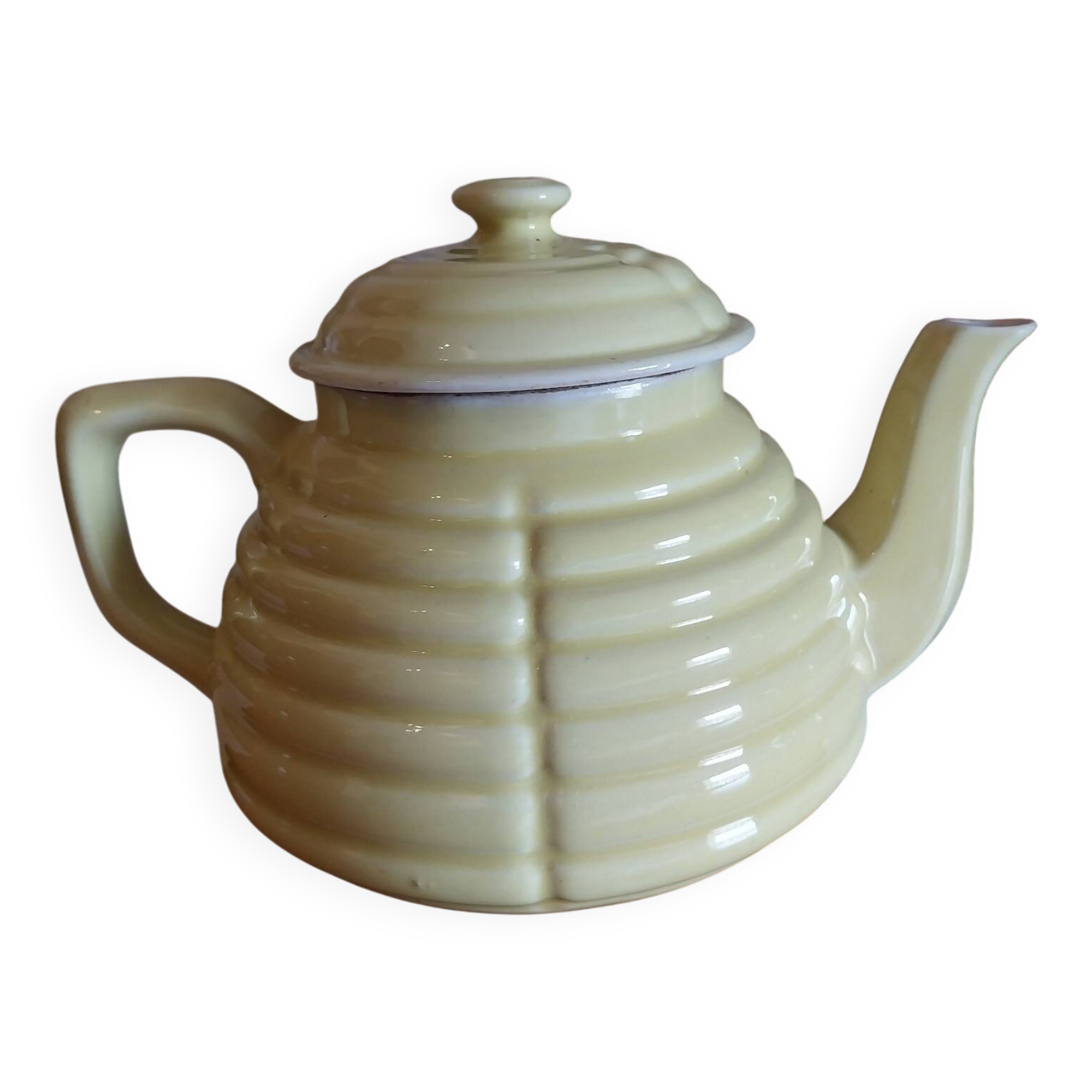 Old yellow earthenware teapot