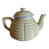 Old yellow earthenware teapot