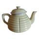 Old yellow earthenware teapot