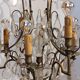 Neoclassical bronze chandelier with 8 lights, tassels and dagger