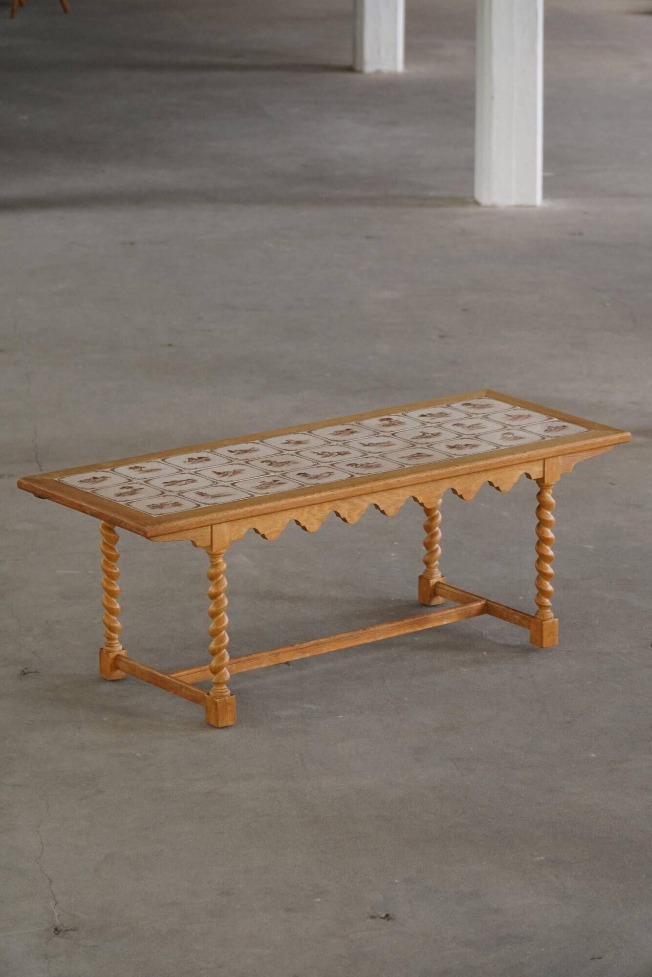 Mid-century modern Danish coffee table in oak with a ceramic top, 1950s.