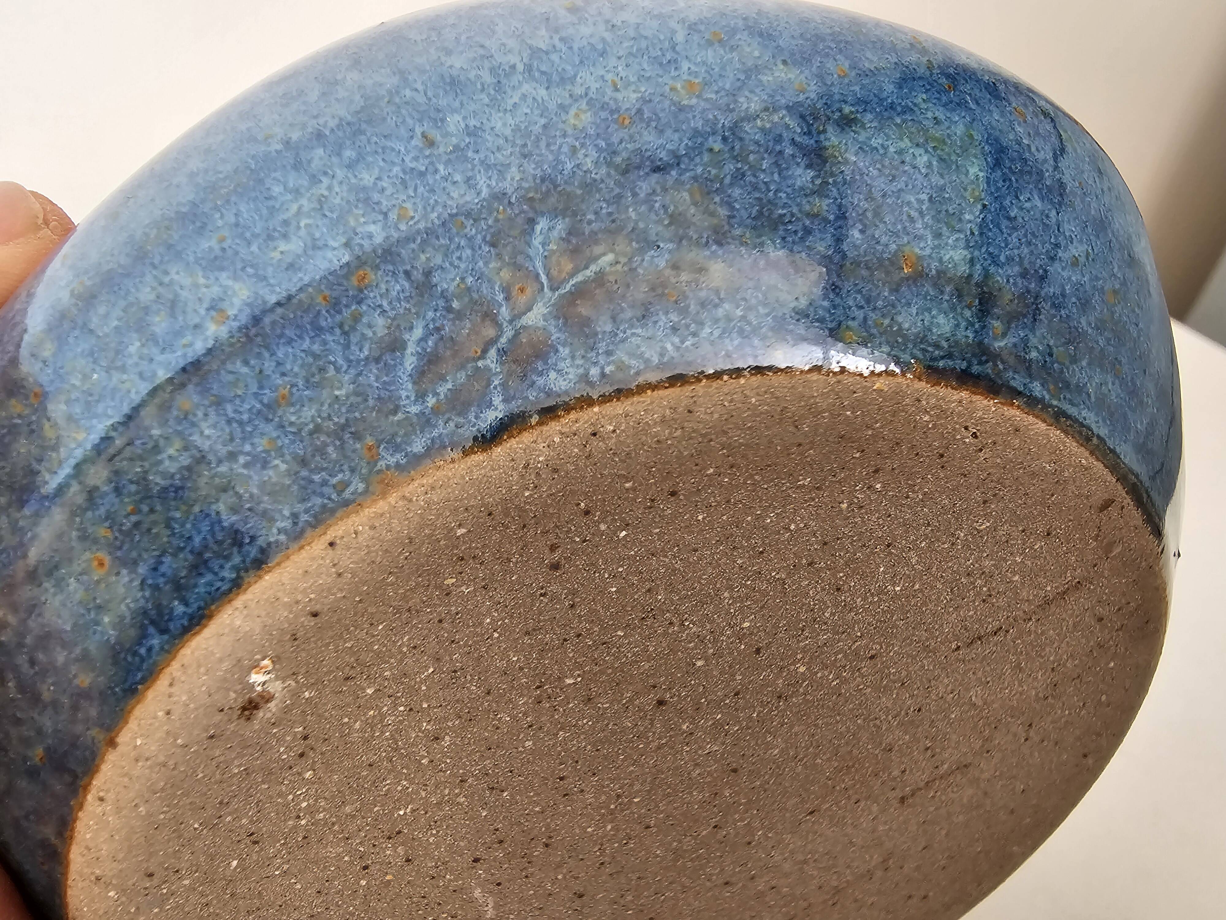 Blue ceramic catchall ashtray in a free form, signed CH.