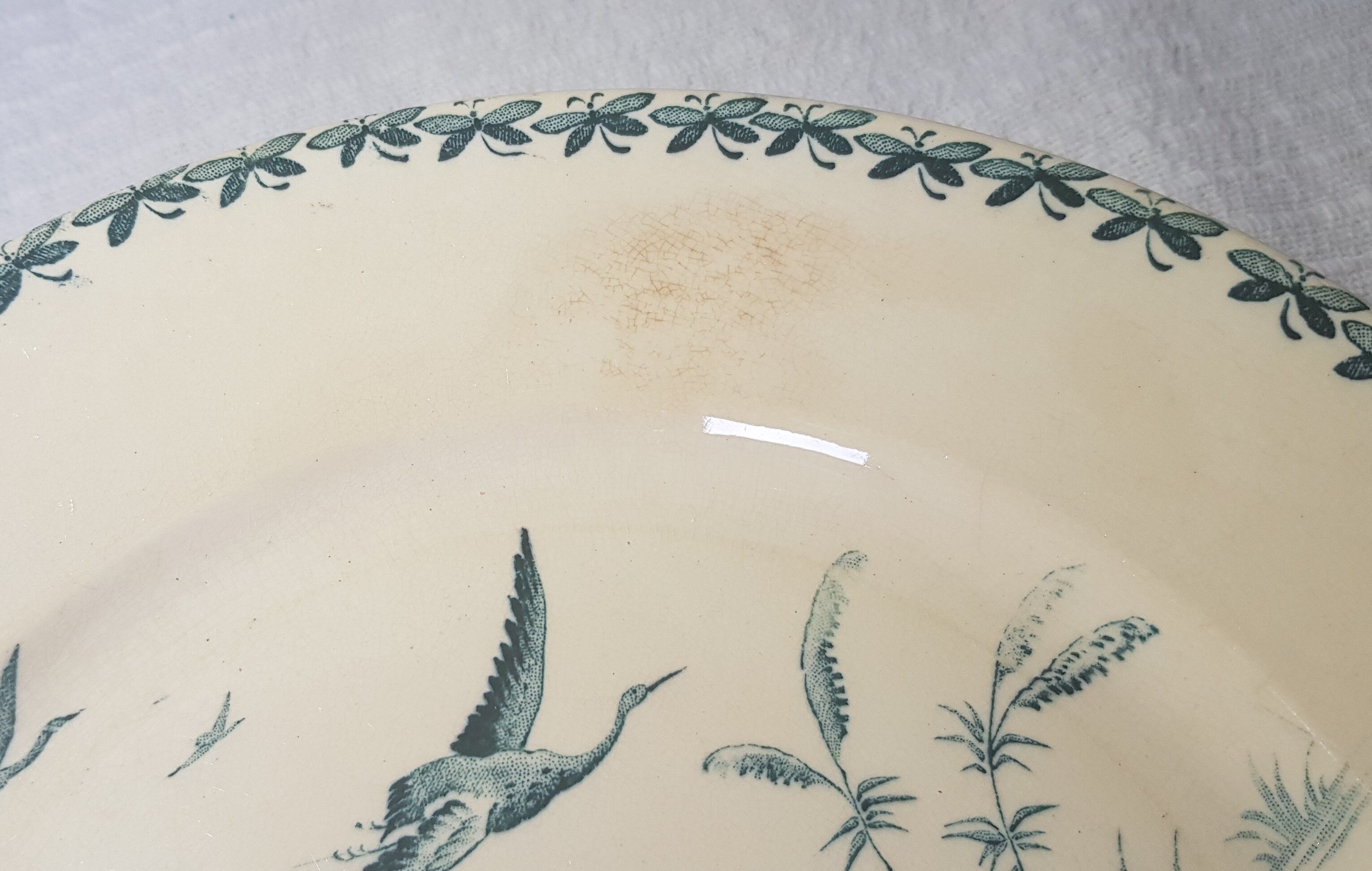 3 flat plates made of Badonviller earthenware model Nenuphar, iron earth