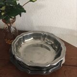 Two matching round dishes in stainless steel