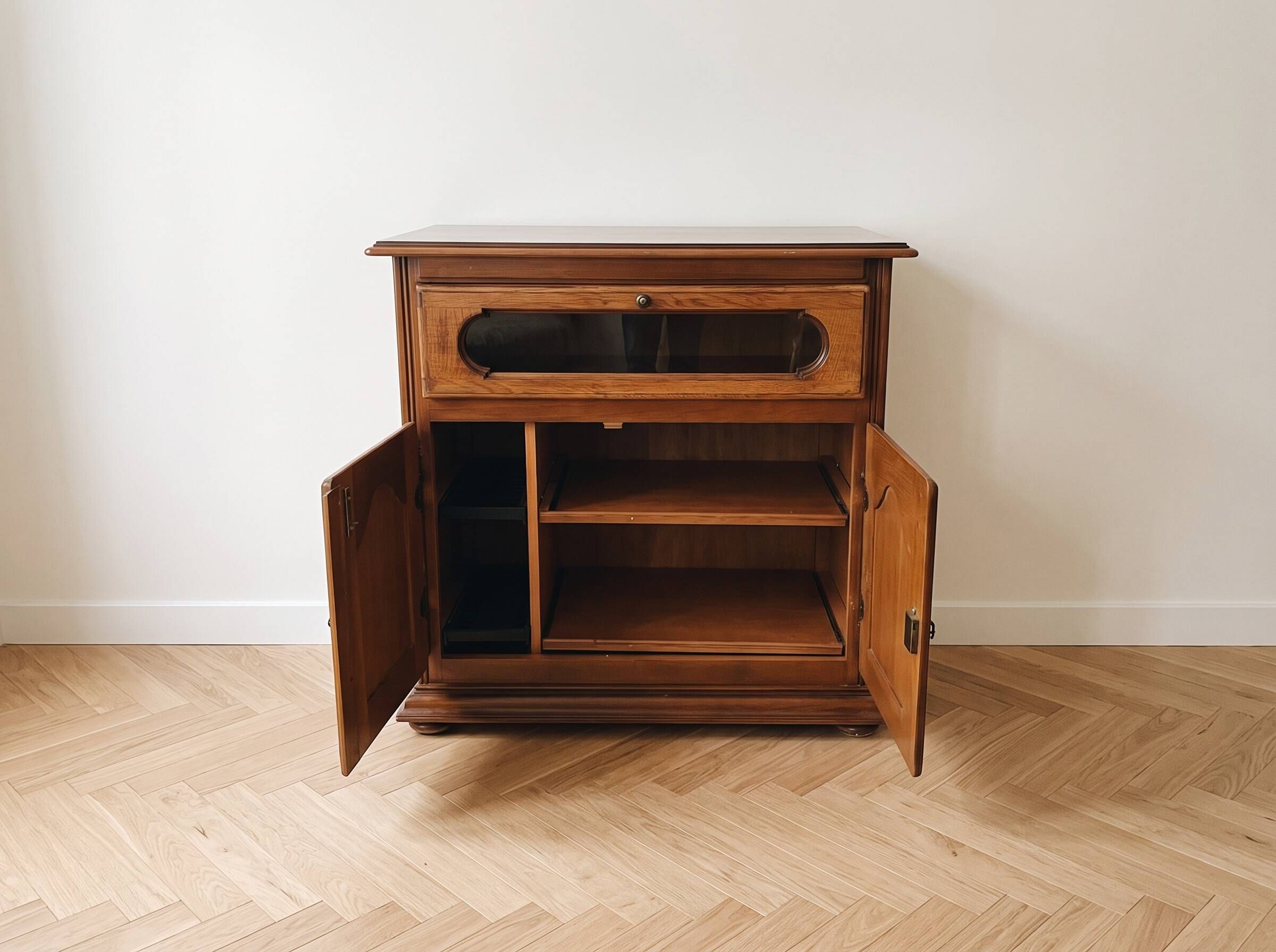 Rustic wooden TV unit with a swivel top and moulded doors.