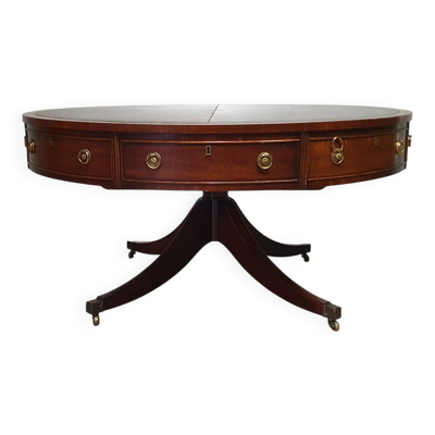 Table basse / table tambour victorienne « Heldense » en acajou avec plateau en cuir sur roulettes en laiton. Années 1980