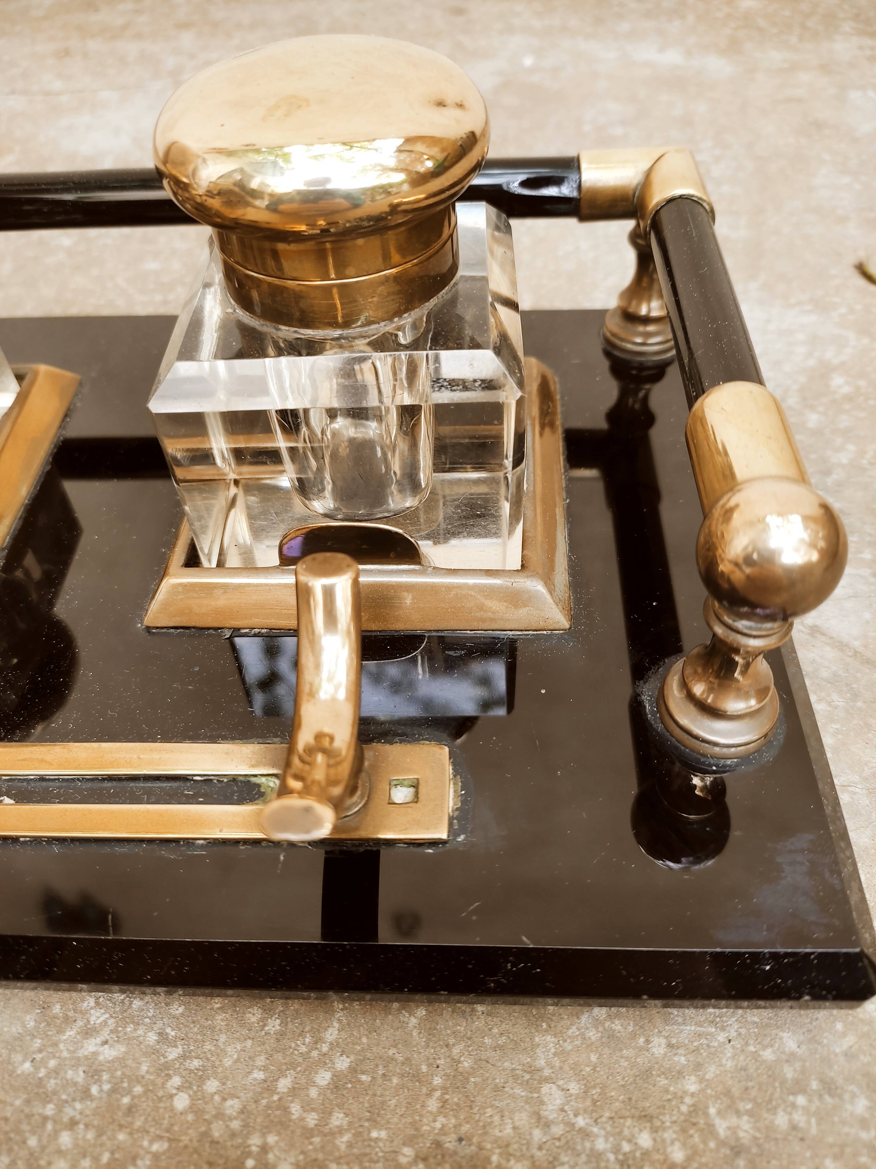 Hence the art deco inkwell on jet plate brass finishes