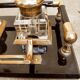 Hence the art deco inkwell on jet plate brass finishes