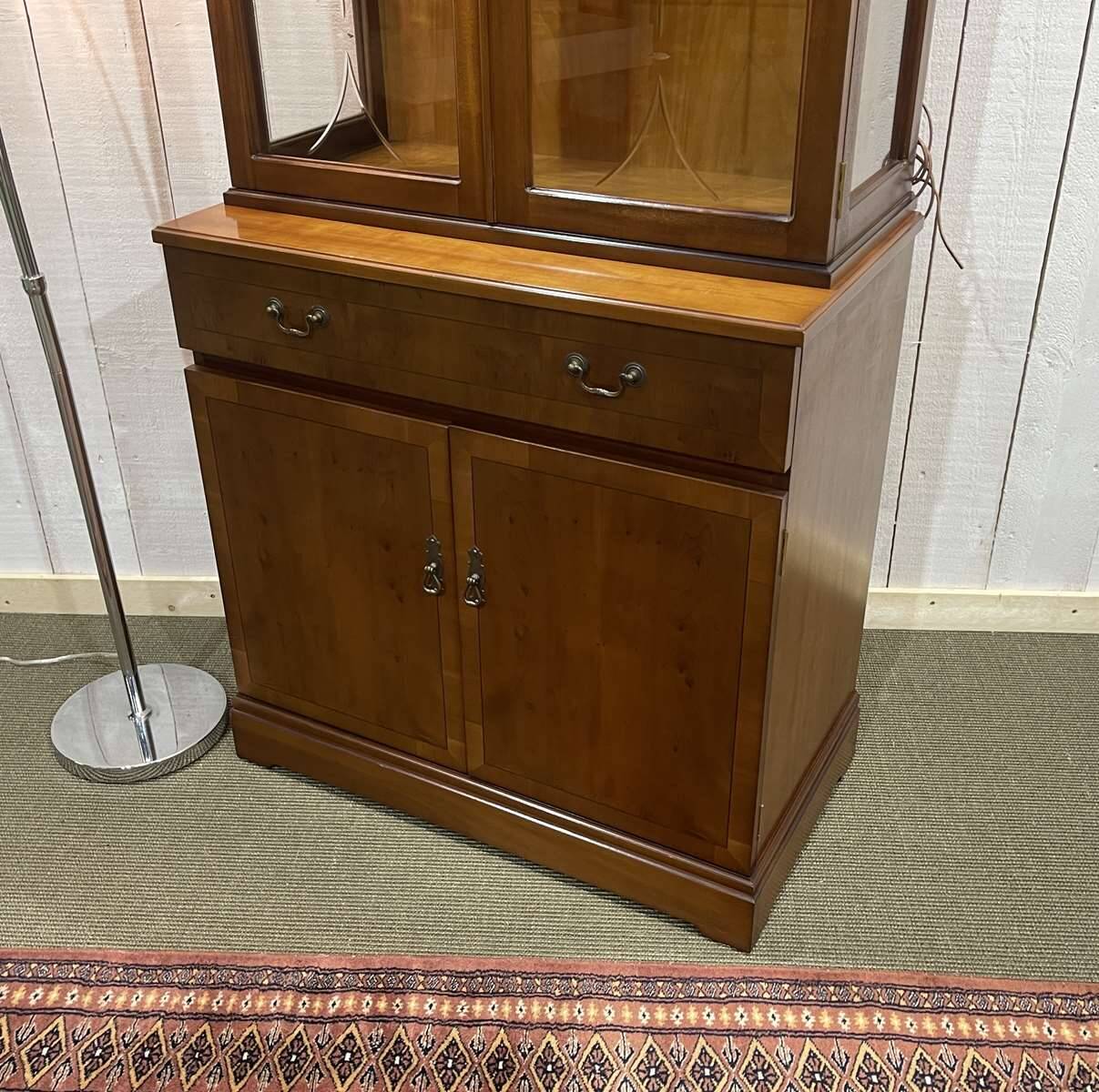 English display cabinet with two sections made of yew from the 1980s.
