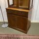 English display cabinet with two sections made of yew from the 1980s.