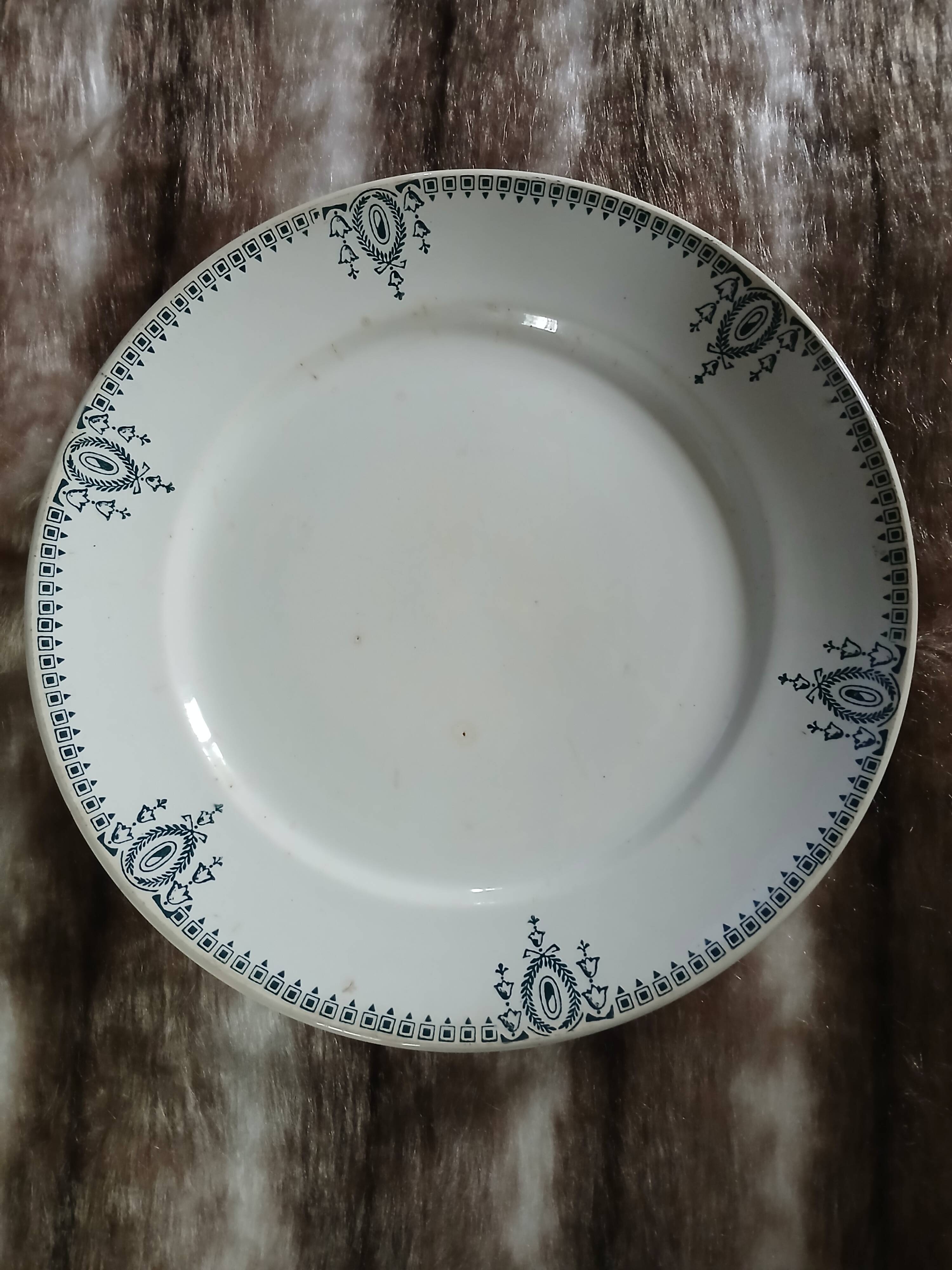 Old round plate made of ironstone