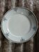Plat rond ancien en terre de fer