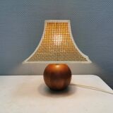 Very rare table lamp in turned teak wood with original braided shade. 1970s