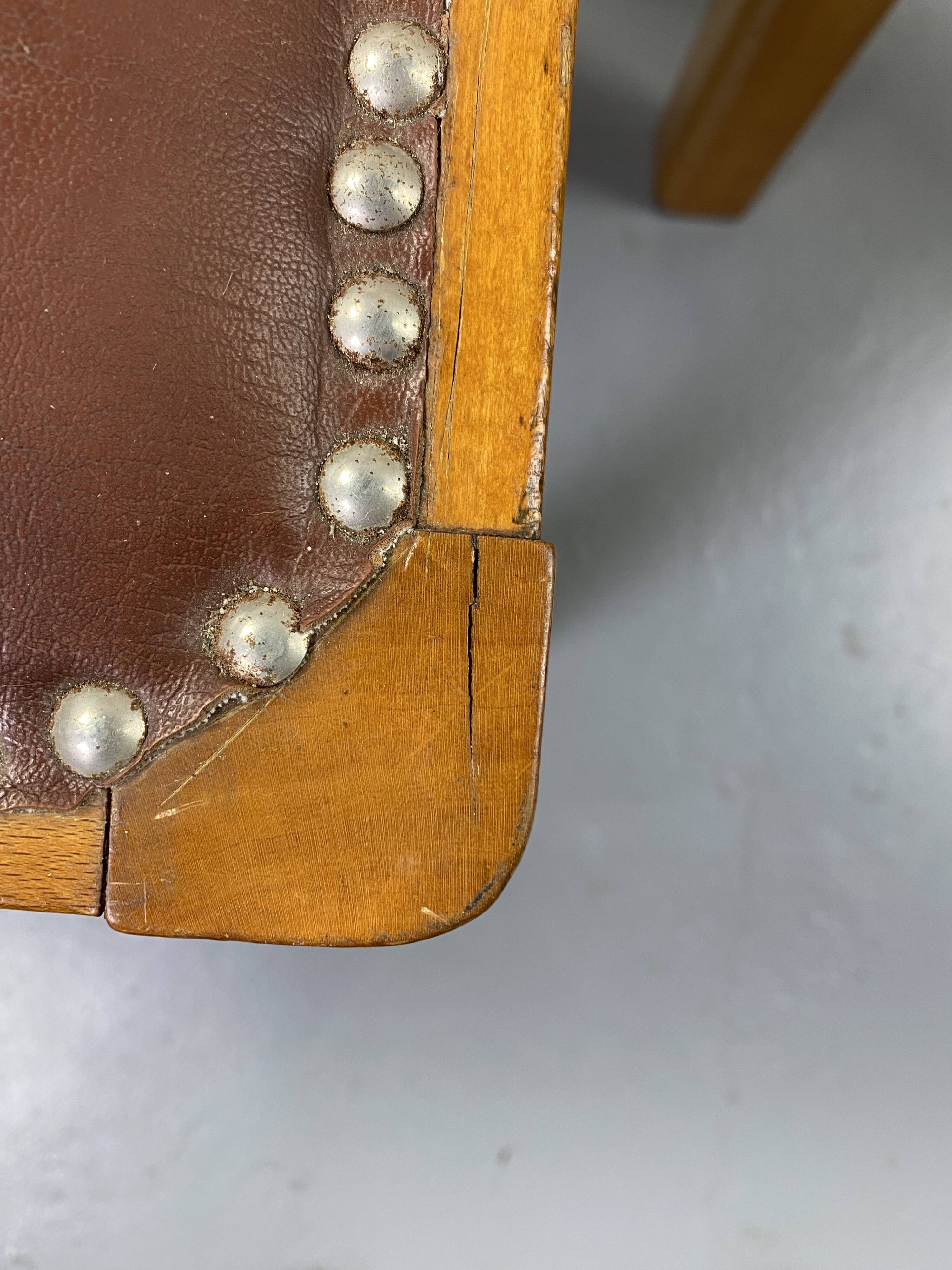 Pair of wooden and leather chairs