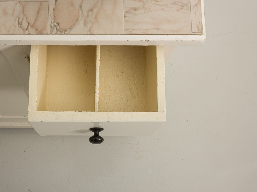 Small accent cabinet with drawers and swing doors