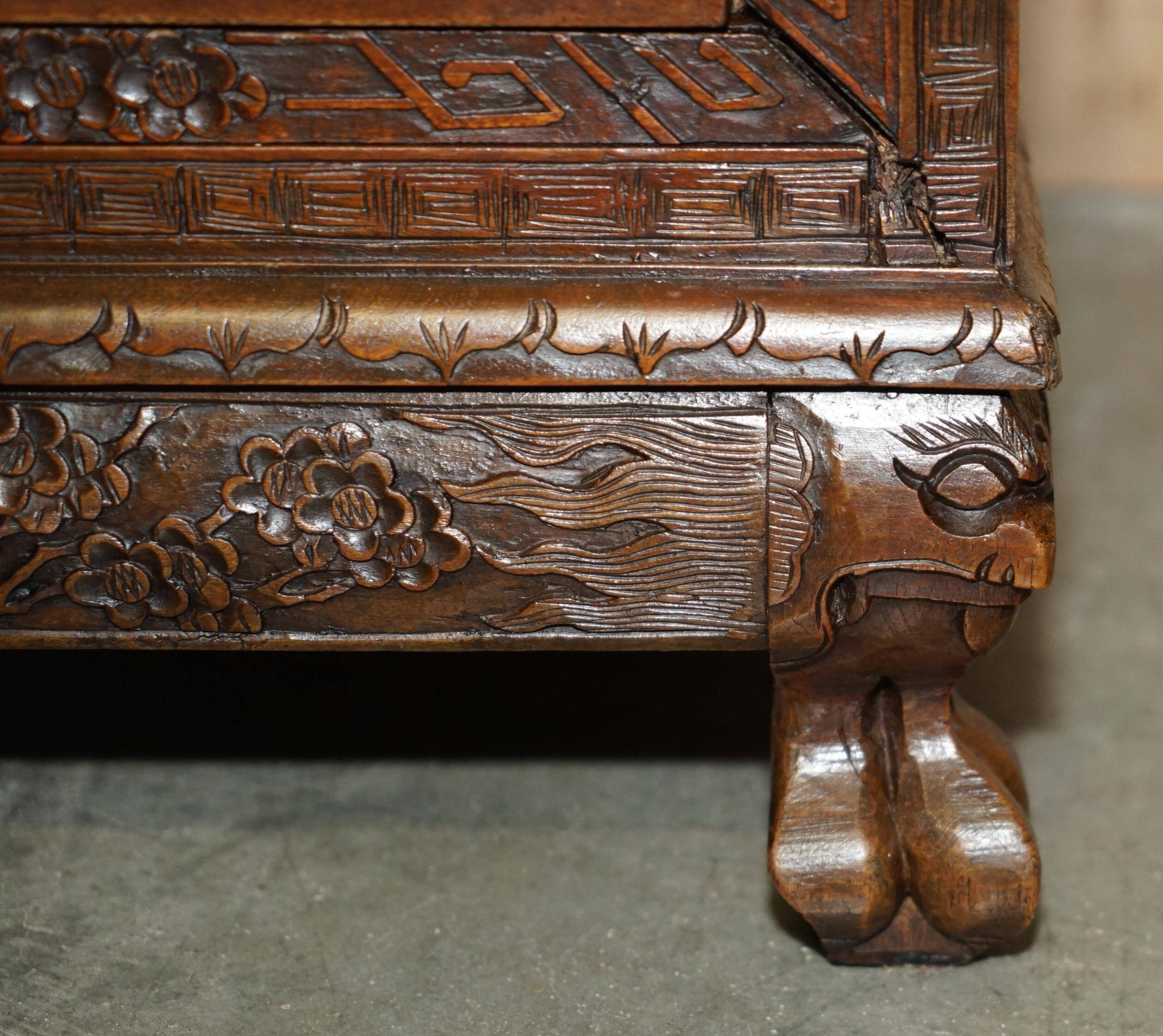 Antique Chinese commode hand-carved circa 1890 with detailed handles.