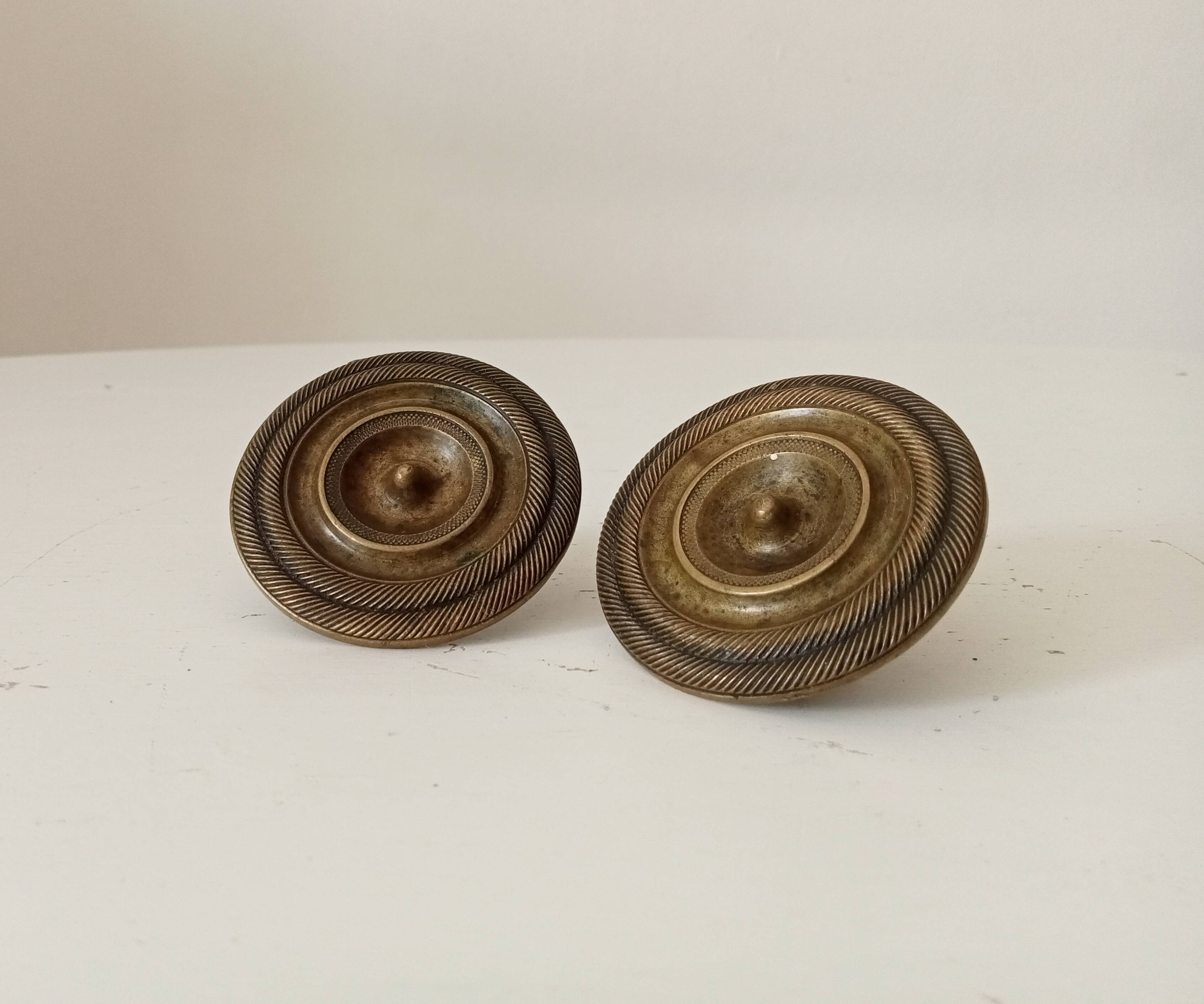 Pair of 19th-century Empire-style solid bronze furniture handles.