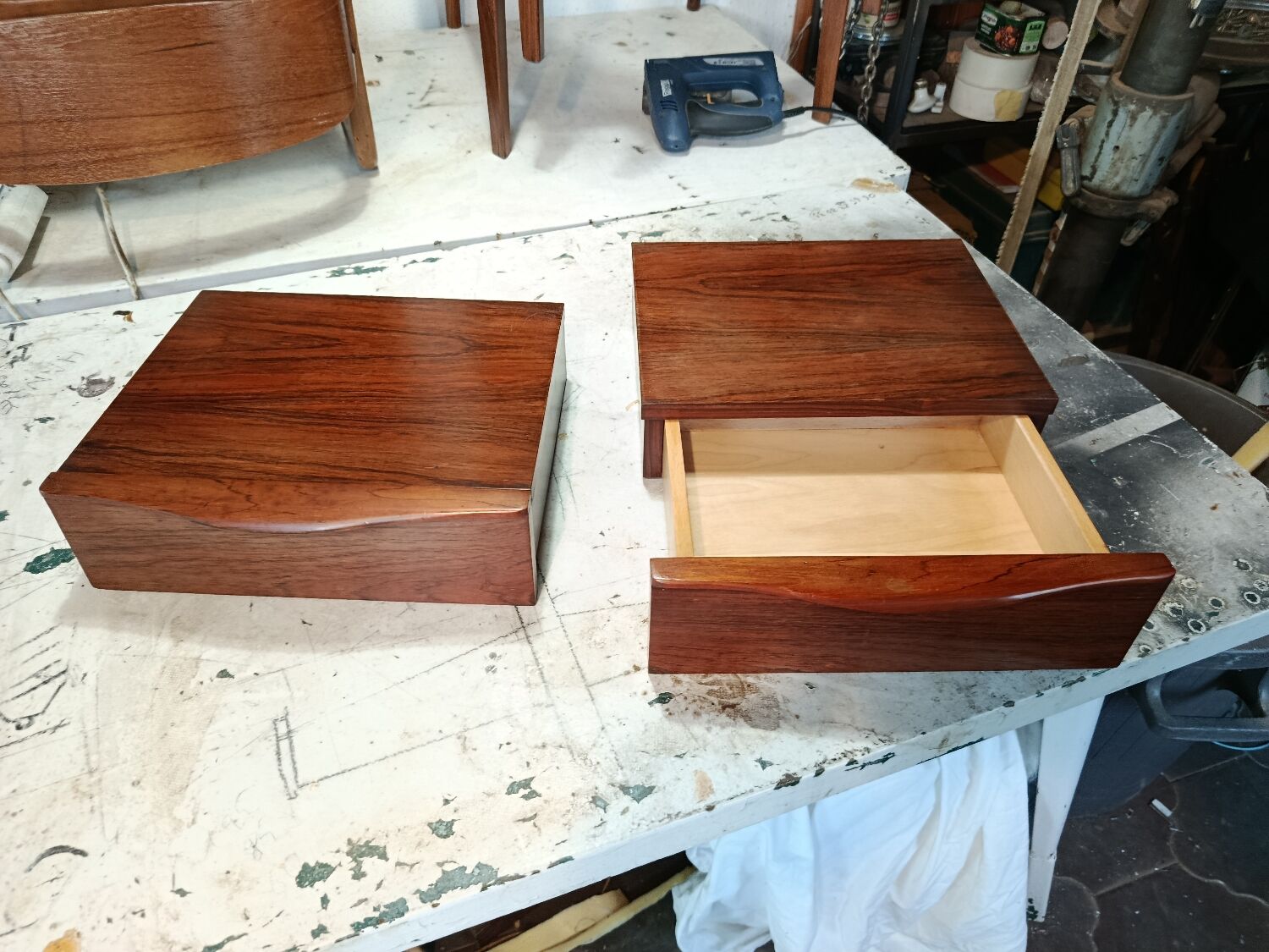 Scandinavian suspended bedside tables in rosewood.