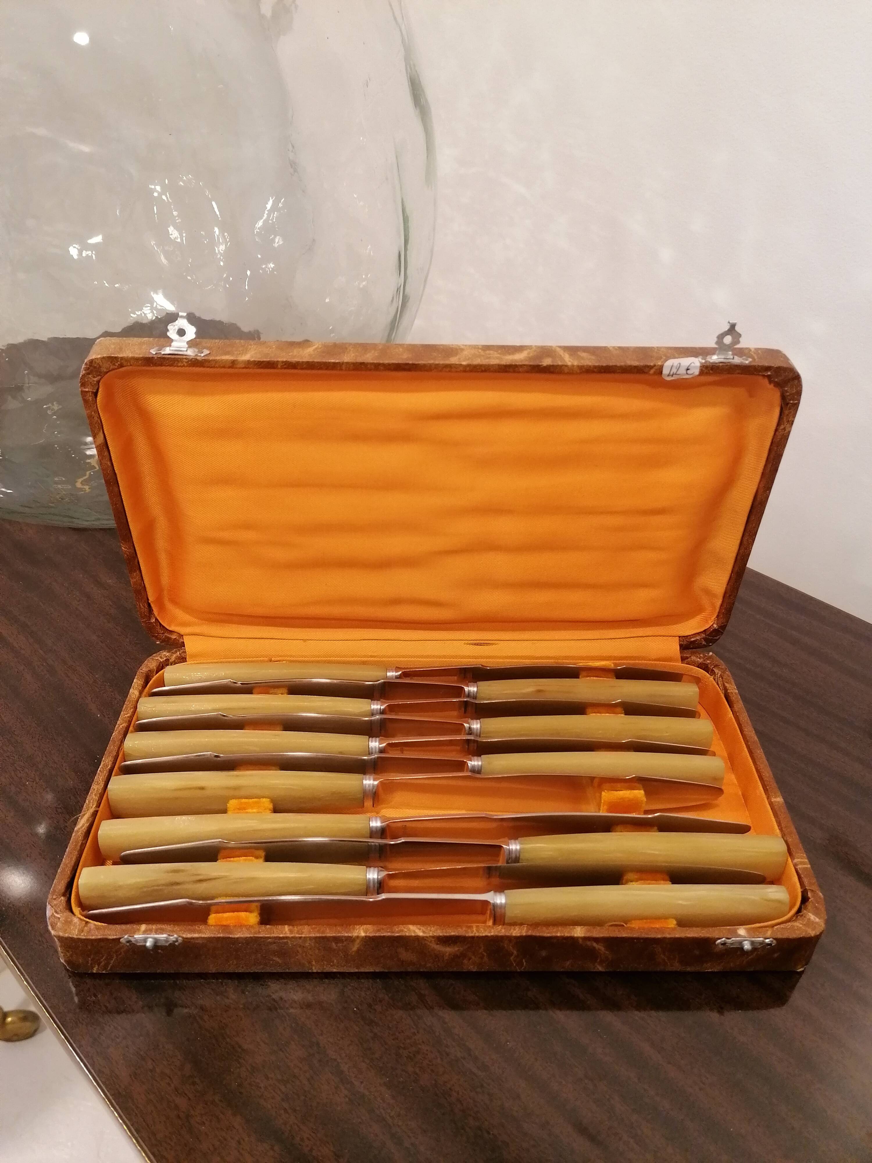 Box of 11 stainless steel knives with bakelite handles