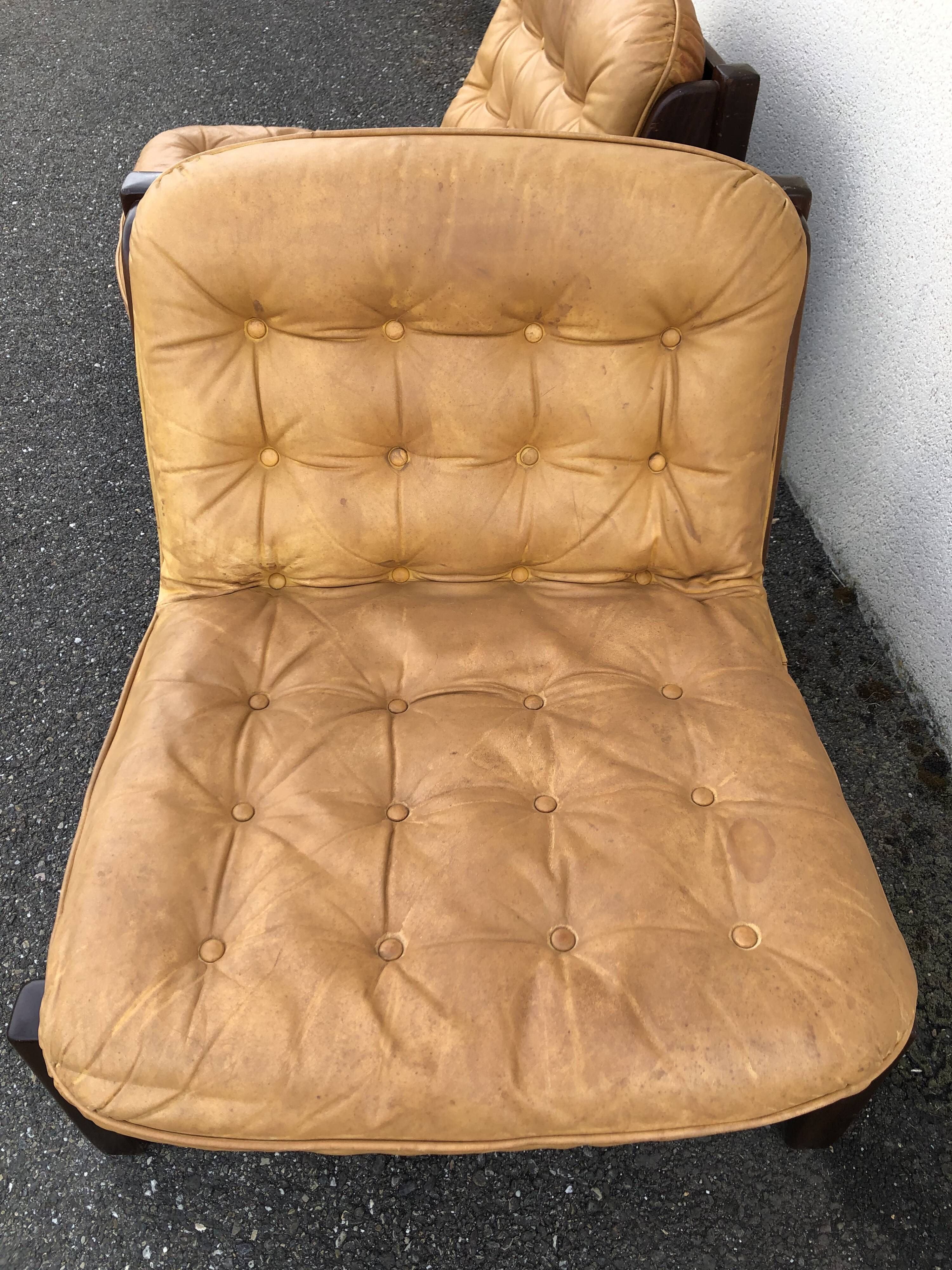 Leather and wood armchairs 70s