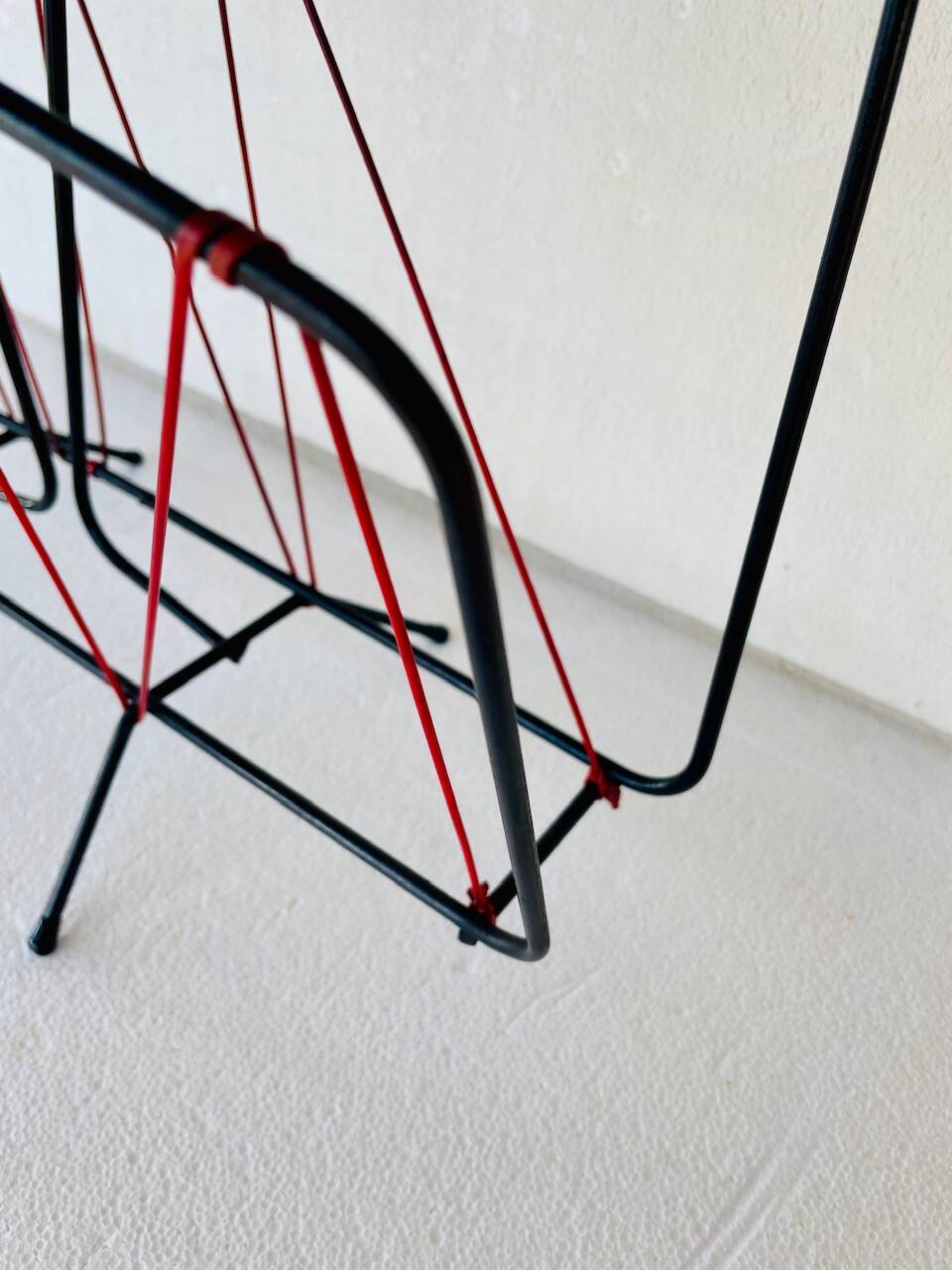 Vintage black metal magazine rack circa 19