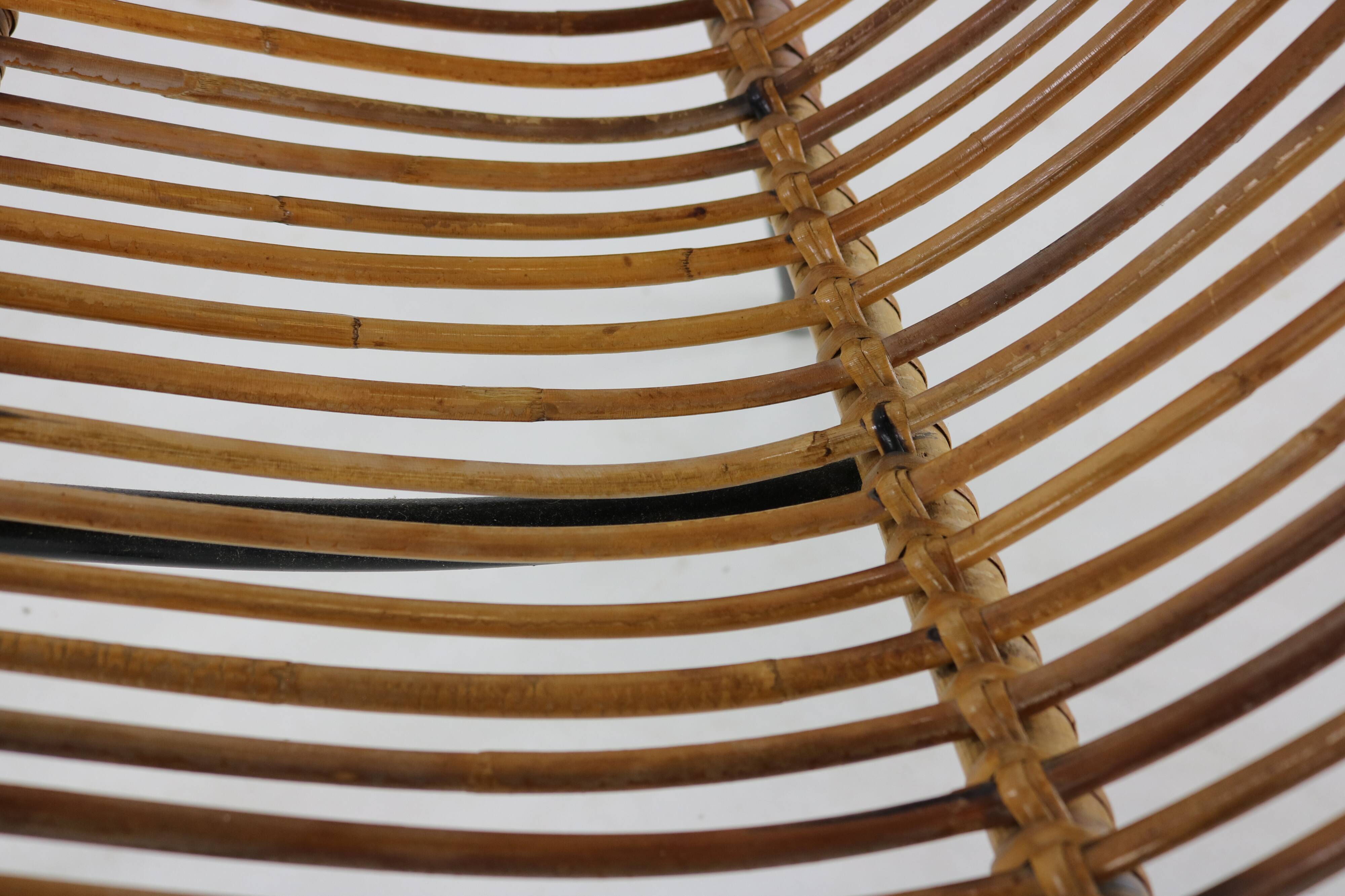 Three legged dutch design rattan easy chair by D. van Sliedregt