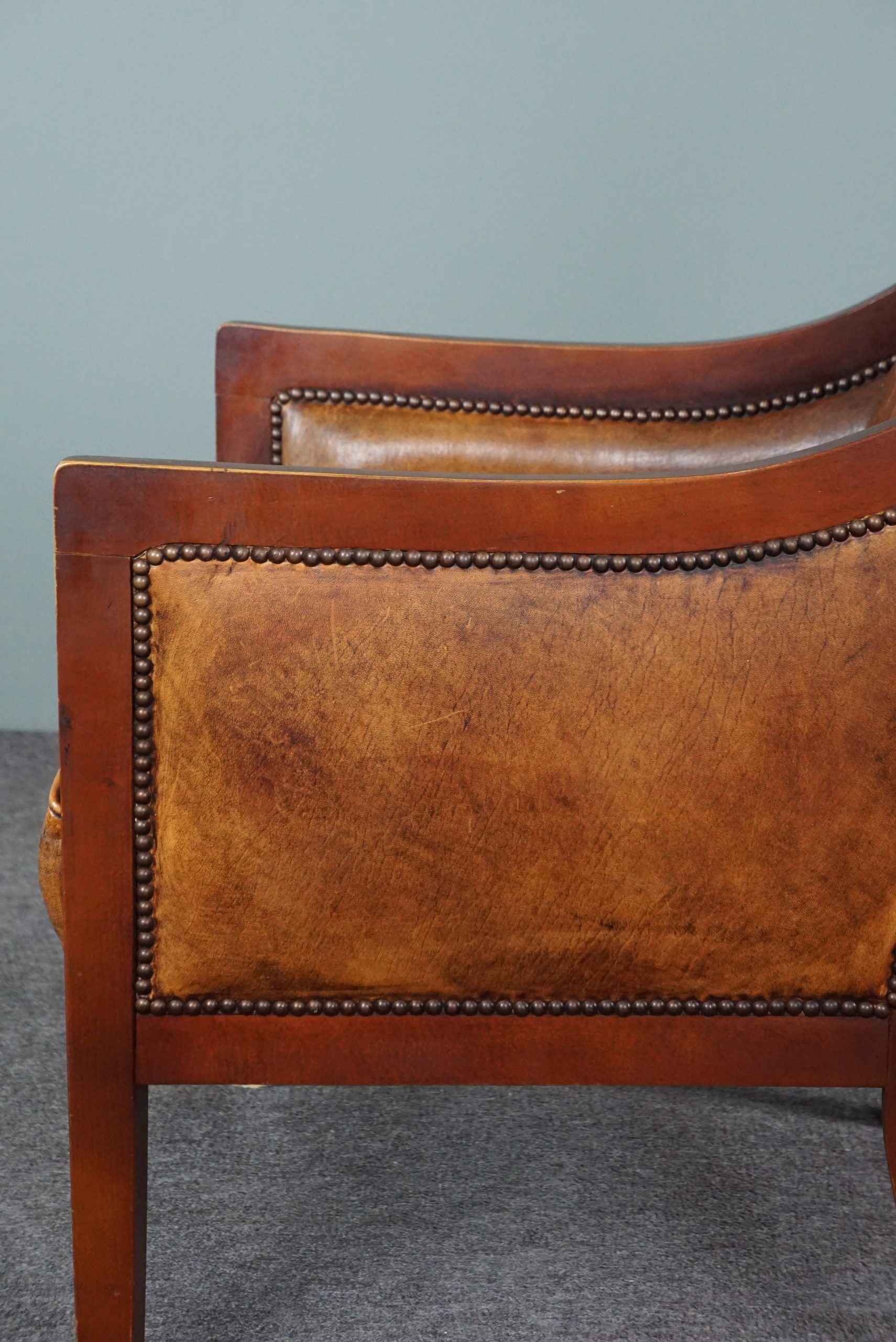 Armchair in sheepskin with wood