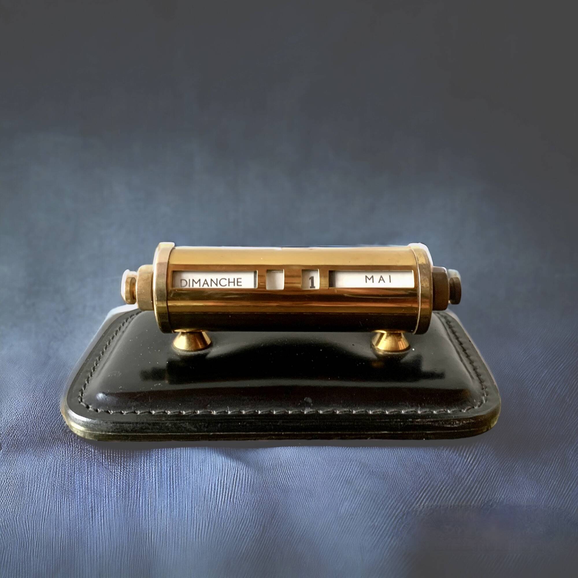 Old perpetual calendar in leather and brass