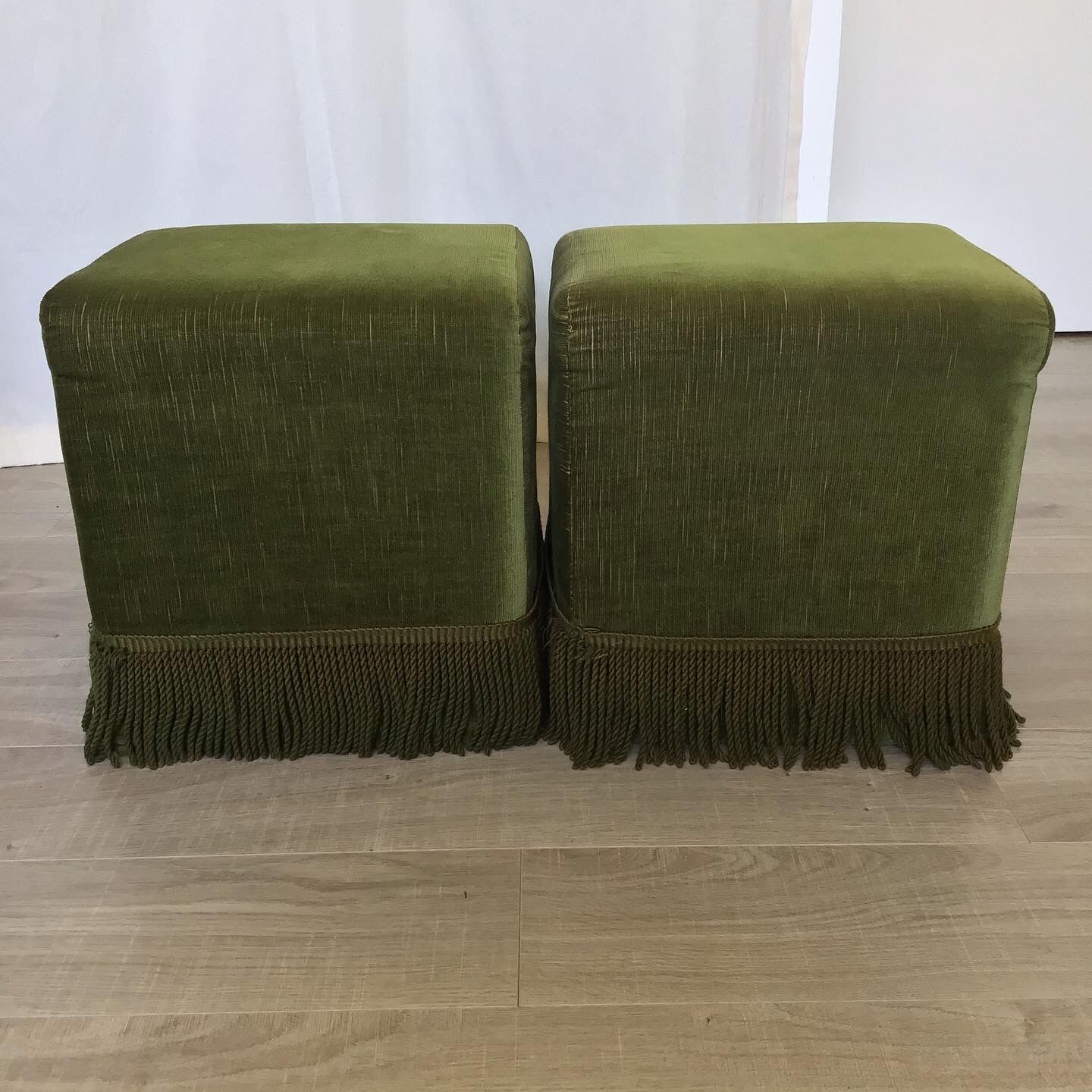 Pair of khaki green velvet beanbags